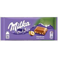 Шоколад Milka молочный с кусочками лесного ореха 100 г фото Шоколад Milka молочный с кусочками лесного ореха 100 г