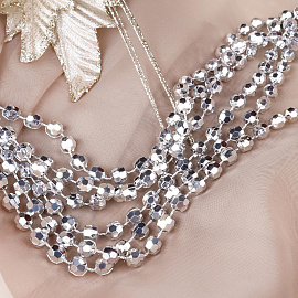 Бусы новогодние на елку Miland Торжество 1000 см пластиковые серебристые фото Бусы новогодние на елку Miland Торжество 1000 см пластиковые серебристые