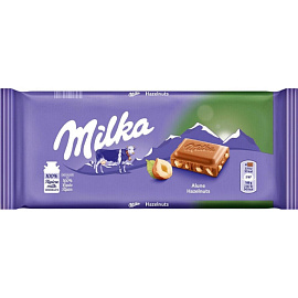 Шоколад Milka молочный с кусочками лесного ореха, 90г